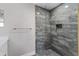 Bathroom shower with glass doors and modern tile at 10033 Canterbury Dr, Leesburg, FL 34788
