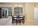 Cozy breakfast nook with tile floors, natural light and sliding doors to a screened in lanai at 105 E Blue Water Edge Dr, Eustis, FL 32736