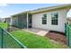The backyard features a screened patio and a secure fence at 10977 Se 169Th Ln, Summerfield, FL 34491