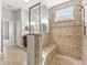 Luxurious bathroom featuring a separate shower, bench, and double mirrors above vanity at 10977 Se 169Th Ln, Summerfield, FL 34491