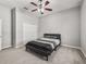 Comfortable bedroom with a ceiling fan and a large closet at 10977 Se 169Th Ln, Summerfield, FL 34491