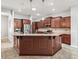 Spacious kitchen features granite counters, stainless steel appliances and ample cabinet storage at 10977 Se 169Th Ln, Summerfield, FL 34491