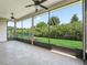 Relaxing screened lanai offering beautiful backyard views at 10977 Se 169Th Ln, Summerfield, FL 34491