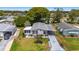 An aerial view of the property showcases the home's well-maintained landscaping and convenient carport at 1109 Paradise Dr, The Villages, FL 32159