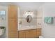 Traditional bathroom featuring a vanity with tile countertop and wooden cabinets at 1109 Paradise Dr, The Villages, FL 32159