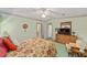 Cozy bedroom with warm tones, natural light, and comfortable furnishings at 1109 Paradise Dr, The Villages, FL 32159