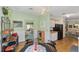 Inviting dining area with elegant decor, seamlessly connected to the kitchen at 1109 Paradise Dr, The Villages, FL 32159