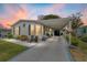 Well-maintained single-story home with a covered carport, beautiful landscaping, and charming curb appeal at 1109 Paradise Dr, The Villages, FL 32159