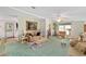 Comfortable living room with a ceiling fan, neutral tones, and elegant decor at 1109 Paradise Dr, The Villages, FL 32159