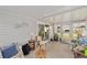 Bright sunroom with sliding glass doors and comfortable seating at 1109 Paradise Dr, The Villages, FL 32159