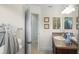 Bathroom featuring a sink with storage, towels hanging on the wall, and a peek into a nearby room at 1140 Eureka Mill Run, The Villages, FL 32162