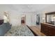 Bedroom with a ceiling fan shows the doorway to the bathroom and the closet space in the room at 1140 Eureka Mill Run, The Villages, FL 32162