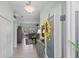 Bright foyer with neutral paint and decorative details, leading into the living area at 1140 Eureka Mill Run, The Villages, FL 32162