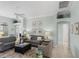 Spacious living room featuring comfortable sofas and stylish decor, ideal for relaxation at 1140 Eureka Mill Run, The Villages, FL 32162