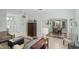 Open concept living and dining area with tile flooring and neutral paint at 1140 Eureka Mill Run, The Villages, FL 32162