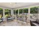 Cozy sunroom with tile flooring and lots of natural light at 1140 Eureka Mill Run, The Villages, FL 32162