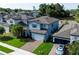 Aerial view of the beautiful home with a well-manicured lawn and lush landscaping at 1268 Patterson Ter, Lake Mary, FL 32746