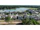 An aerial shot shows a new neighborhood with pond views near a treed horizon at 1268 Patterson Ter, Lake Mary, FL 32746