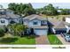 Aerial view of the beautiful home with a well-manicured lawn and lush landscaping at 1268 Patterson Ter, Lake Mary, FL 32746