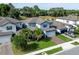 Aerial view of the beautiful home with a well-manicured lawn, driveway, and lush landscaping at 1268 Patterson Ter, Lake Mary, FL 32746
