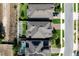 Straight down aerial view of three houses with backyard fences, dark roofs, and neat landscaping at 1268 Patterson Ter, Lake Mary, FL 32746