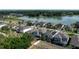 A beautiful aerial view of a new neighborhood near a pond and lush green trees at 1268 Patterson Ter, Lake Mary, FL 32746