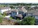 Aerial view of the back of the home showing the screen-in patio and lake view at 1268 Patterson Ter, Lake Mary, FL 32746