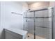 Modern bathroom featuring a glass-enclosed shower with tiled walls and sleek fixtures at 1268 Patterson Ter, Lake Mary, FL 32746