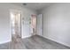 Bright bedroom features gray wood flooring, a walk-in closet, and an ensuite bathroom with a shower at 1268 Patterson Ter, Lake Mary, FL 32746