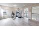 Spacious bonus room featuring bright windows and exercise equipment at 1268 Patterson Ter, Lake Mary, FL 32746