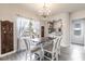 Charming dining area with decorative accents, a chandelier, and natural light from the window at 1268 Patterson Ter, Lake Mary, FL 32746