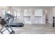 Spacious gym area with treadmill and exercise equipment, open to the upper level at 1268 Patterson Ter, Lake Mary, FL 32746