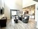 Open-concept living room with high ceilings and sliding glass doors to the patio at 1268 Patterson Ter, Lake Mary, FL 32746