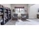 Inviting living room with armchairs, bookshelf, decor and large window offering natural light at 1268 Patterson Ter, Lake Mary, FL 32746