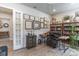Comfortable living room with a ceiling fan, wood-look floors, and French doors leading to another room at 1268 Patterson Ter, Lake Mary, FL 32746