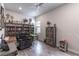 Cozy living room with a ceiling fan, wood-look floors, and stylishly decorated bookshelves at 1268 Patterson Ter, Lake Mary, FL 32746