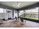 Cozy screened-in patio with brick flooring, ceiling fan and a view of the backyard at 1268 Patterson Ter, Lake Mary, FL 32746