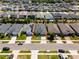 Aerial view of the property showcasing its location in a residential neighborhood at 13304 Magnolia Valley Dr, Clermont, FL 34711
