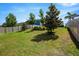 Well-manicured backyard offering ample space, mature landscaping, and a tranquil atmosphere at 13304 Magnolia Valley Dr, Clermont, FL 34711