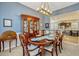 Spacious dining room features a hutch with kitchen view, ample seating, and stylish decor at 13304 Magnolia Valley Dr, Clermont, FL 34711