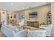Inviting living room with modern décor, comfortable seating, and an entertainment center at 13304 Magnolia Valley Dr, Clermont, FL 34711