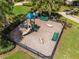 Aerial shot of a community playground area with slides, swings, and benches, perfect for Gathering fun at 13304 Magnolia Valley Dr, Clermont, FL 34711