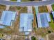 Aerial view of the property, highlighting the house footprint, driveway and surrounding homes at 1437 Apache Cir, Tavares, FL 32778