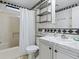 Bathroom featuring a shower and a sleek vanity sink at 1437 Apache Cir, Tavares, FL 32778