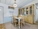 Cozy dining area with a window view and wooden furniture at 1437 Apache Cir, Tavares, FL 32778
