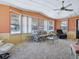 Comfortable living room featuring large windows providing ample natural light and carpet flooring at 1437 Apache Cir, Tavares, FL 32778