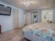 The main bedroom offers a ceiling fan, carpet flooring, a closet, and access to the bathroom at 1437 Apache Cir, Tavares, FL 32778