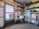 Utility room with door to the outside, a sink, a small work table and shelf storage at 1437 Apache Cir, Tavares, FL 32778