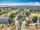 An aerial view of the Legends community, including the golf course, waterways, and beautiful landscaping at 1473 Lakemist Ln, Clermont, FL 34711