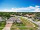 Beautiful single-Gathering home with manicured lawn, brick driveway, and well-maintained landscaping at 1473 Lakemist Ln, Clermont, FL 34711
